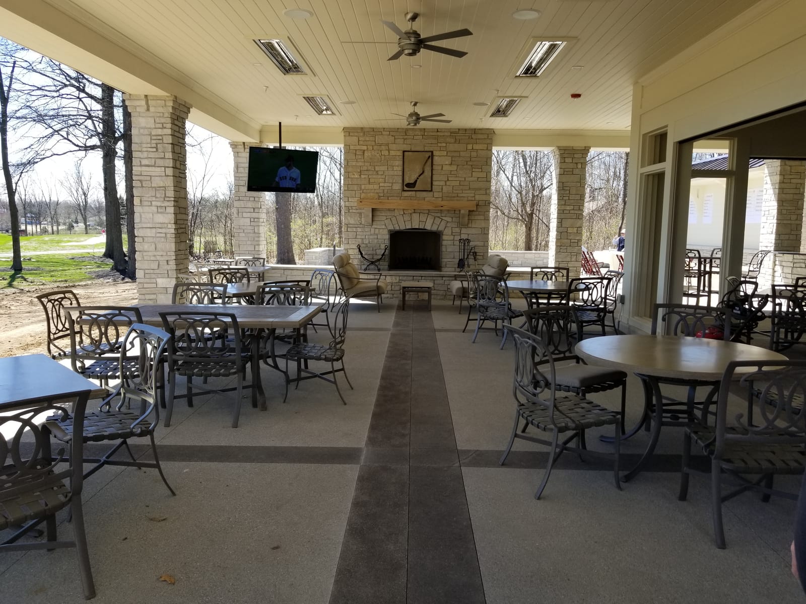 Outdoor television installed on a private country club patio for member viewing