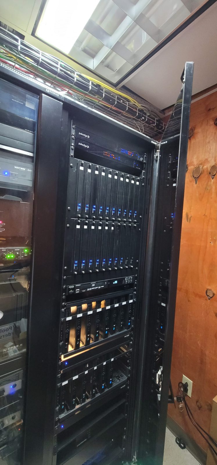 Professional AV equipment rack at a private country club, rack-mounted amplifiers, processors, and managed network gear by Noble A-V