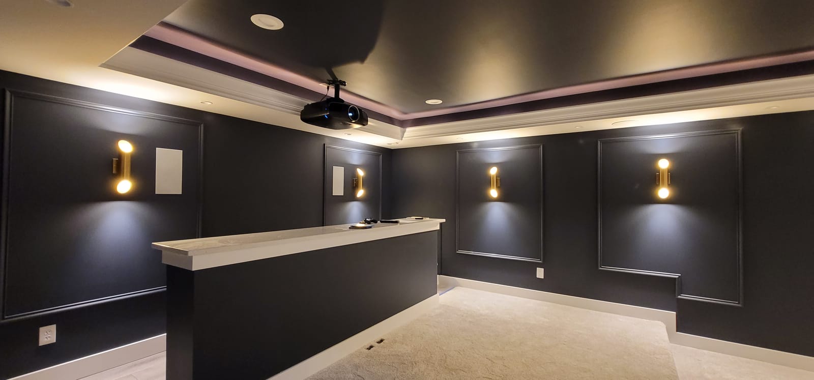 Custom home theater interior with cinematic lighting and acoustic treatment