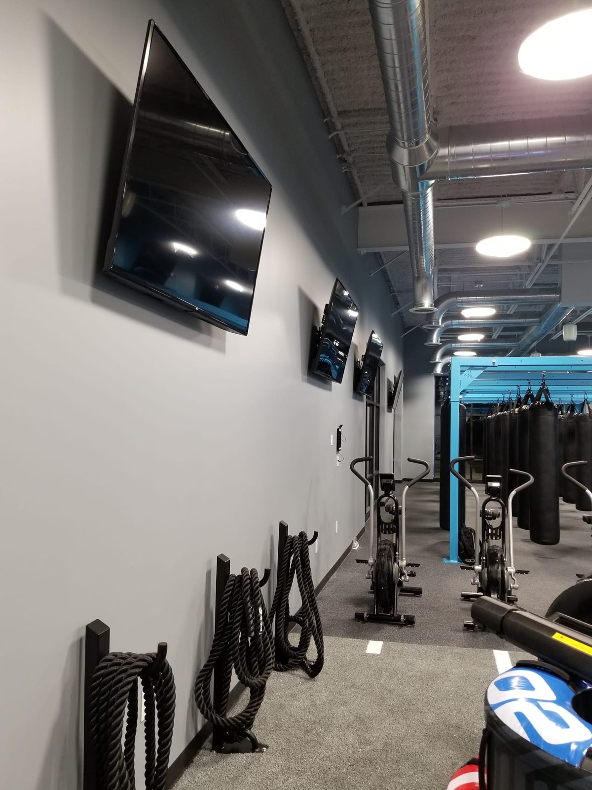 Gymnasium AV install showing multi-display layout