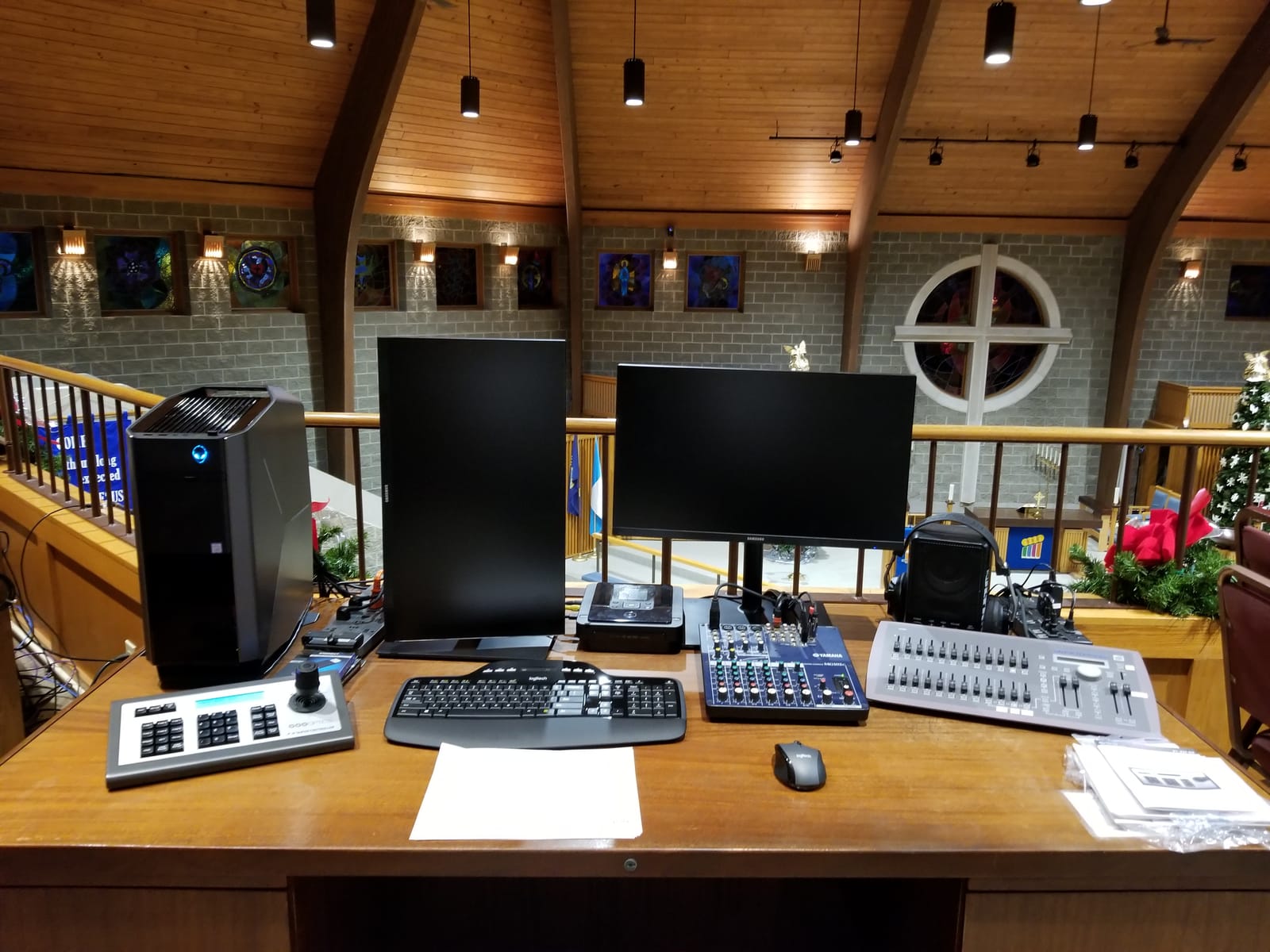 Camera and streaming gear set up in the back of a sanctuary by Noble A-V for live broadcast of services