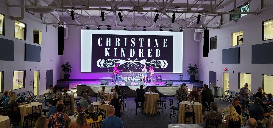Event space with integrated video, audio, lighting, and acoustic treatment by Noble A-V