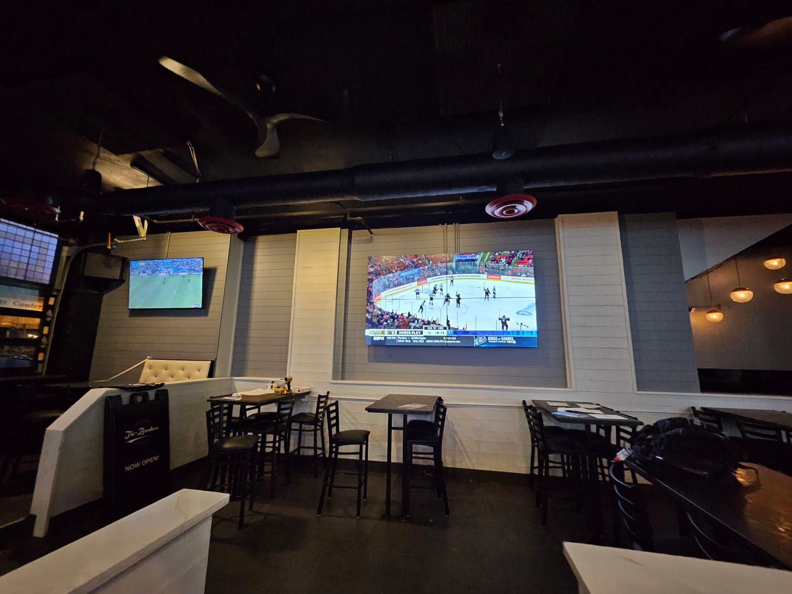 Tie Breakers dining room with wall-mounted televisions for game-day viewing