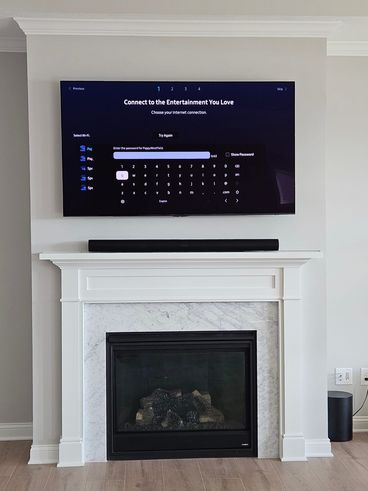 Flat-panel television mounted above a fireplace in a luxury Indianapolis-area home