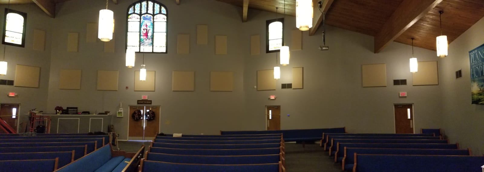 Back wall of sanctuary with acoustic absorber panels installed to reduce reflection